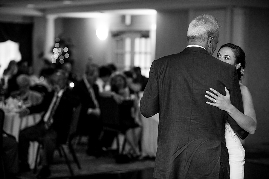 Bride looks at dad during father/daughter dance
