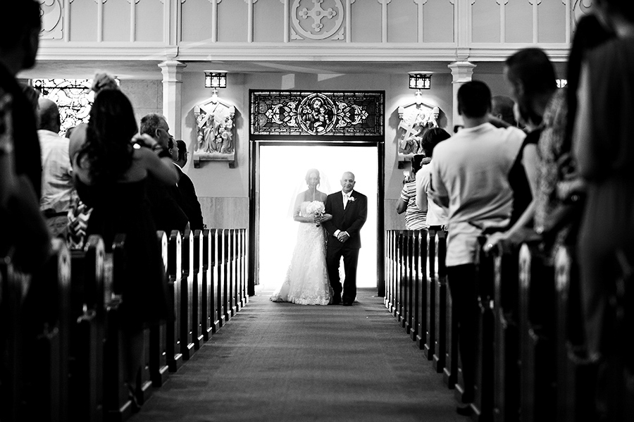 Bride walking down the aisle with her father.