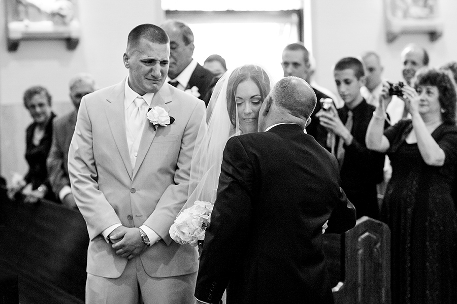 Groom and dad crying as dad gives his daughter away.
