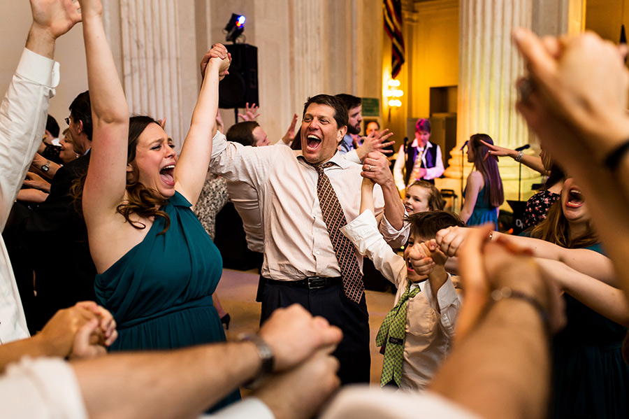 Weddings guests dancing "the shout" at reception.