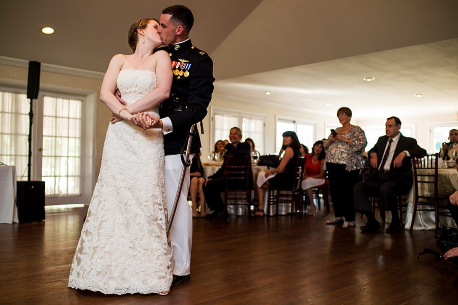 Bride and groom kissing during their first dance on their wedding day.