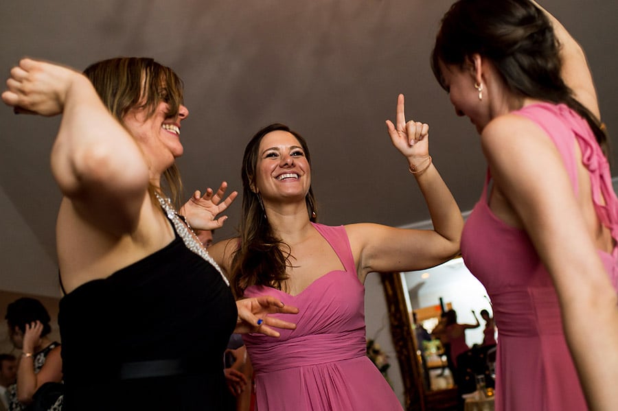 Bridesmaid dances on the dance floor.
