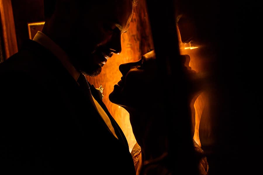 Close up silhouette of a bride and groom on their wedding day.