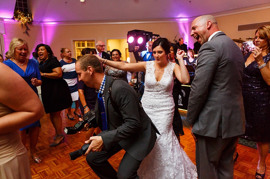 Fun Philadelphia Wedding photographer Dan Moyer and bride dance on her wedding day.