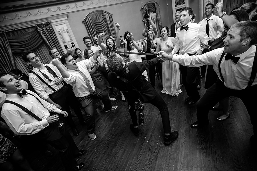 Philadelphia Photographer doing the limbo during wedding day.