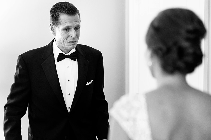 Bride's father sees his daughter for the first time in her wedding dress.