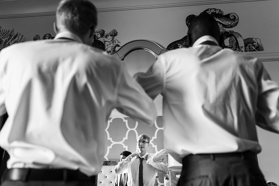 Groom and groomsmen getting ready for wedding at Hotel Monaco in Philadelphia.