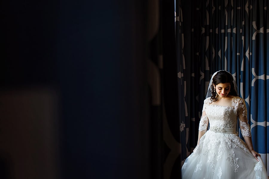 Portrait of a beautiful bride in window light at Hotel Monaco in Philadelphia, PA.