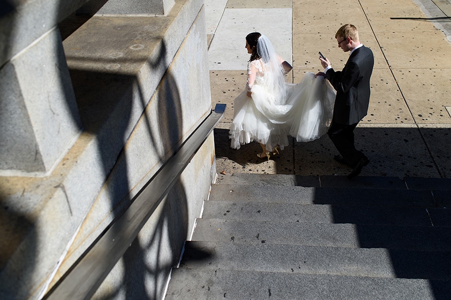 Bride and groom walk in Center City Philadelphia.