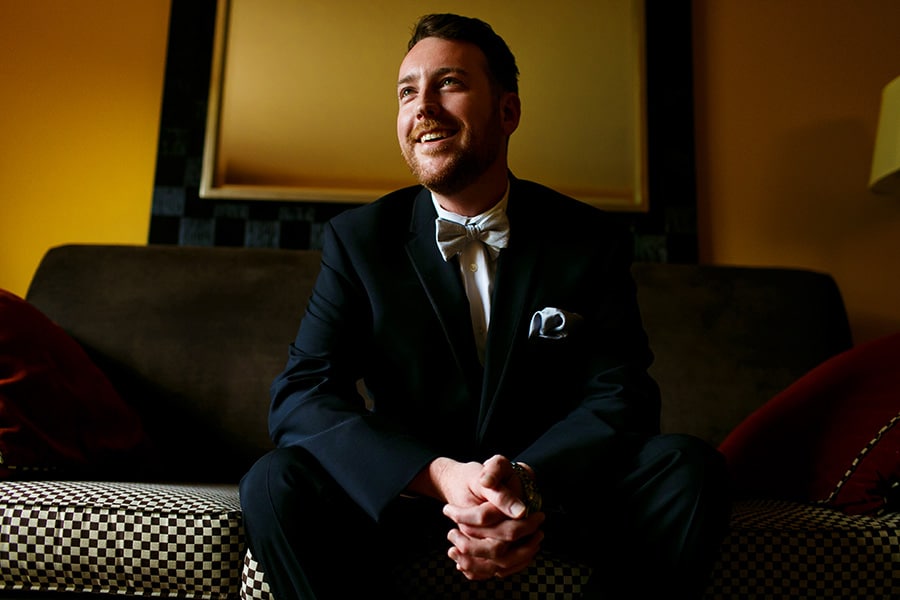 Groom smiles as he sits and waits for ceremony at Bear Creek Mountain Resort in Macungie, PA.